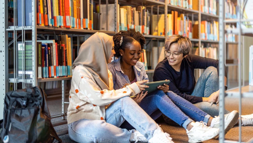 Group of diverse students in a library